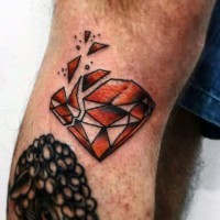 Simple designed and colored broken diamond tattoo on leg