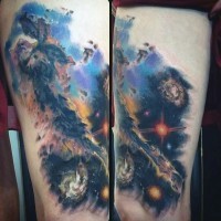 Simple designed multicolored space tattoo on thigh