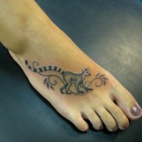 Simple elegant gray-ink lemur tattoo on foot