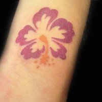 Simple hibiscus flower tattoo on arm