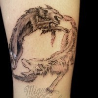 Simple homemade colored circle shaped fighting wolves tattoo