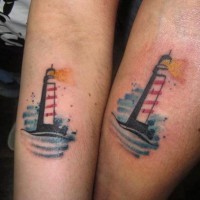 Simple homemade colored tiny lighthouse tattoo on forearm zone