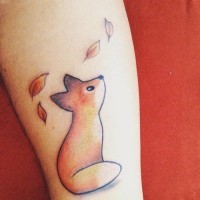 Simple homemade like colored tiny fox tattoo on forearm combined with leaves