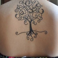 Simple homemade like little black ink tree tattoo on upper back