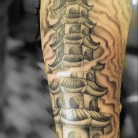 Simple homemade style black ink forearm tattoo of ancient temple in fog