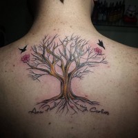Simple homemade style painted colored tree with flowers and birds tattoo on back combined with lettering