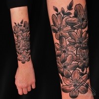 Simple illustrative style arm tattoo of big flowers with leaves
