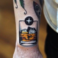 Simple illustrative style colored wrist tattoo of whiskey shot