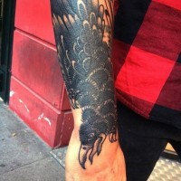 Simple old school black ink crow tattoo on wrist