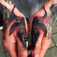 Simple old school painted divided goat head tattoo on hands