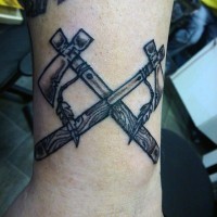 Simple old school style black ink crossed axes tattoo on wrist