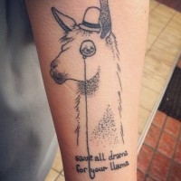 Simple painted black ink wise lama with lettering tattoo on arm