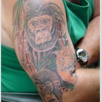 Simple painted colored wild jungle animals tattoo on shoulder in pale colors