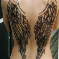 Simple painted detailed and colored wings tattoo on back