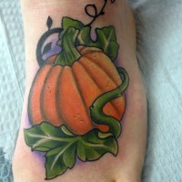 Simple painted little colored pumpkin tattoo on foot