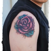Simple painted little red rose tattoo on shoulder
