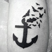 Simple painted mystical black ink anchor with bats tattoo on leg