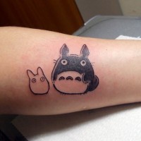 Simple slim colored little forearm tattoo of Asian cartoon heroes