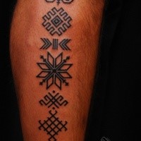 Simple small black ink tattoo of various symbols