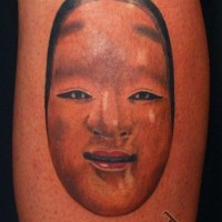 Simple tribal style colored girl portrait tattoo on arm
