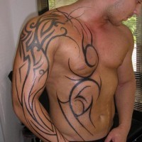 Simple unfinished black ink sleeve and chest tattoo of various tribal ornaments