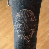 Simple white ink gypsy girl tattoo on arm