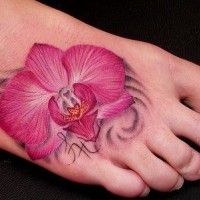 Single red orchid tattoo on foot