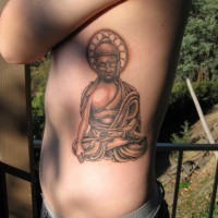 Sitting buddha tattoo on ribs