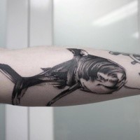 Sketch style black ink arm tattoo of big shark