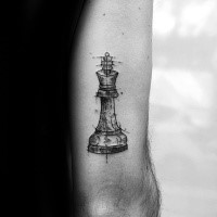 Sketch style black ink arm tattoo of medium size chess figure