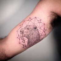 Sketch style black ink biceps tattoo of lion head with ornaments