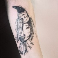 Sketch style black ink forearm tattoo of crow with woman face