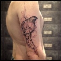 Sketch style black ink shoulder tattoo of small bird