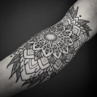 Sketch style black ink tattoo of large flower with leaves