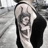 Sketch style black ink upper arm tattoo of demonic woman