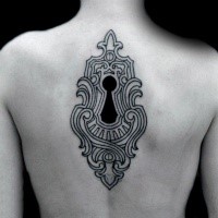 Sketch style black ink upper back tattoo of keyhole