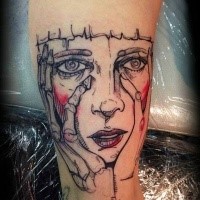 Sketch style colored arm tattoo of creepy woman face