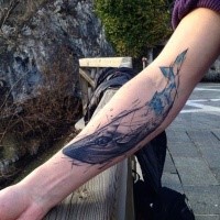 Sketch style colored forearm tattoo of whale