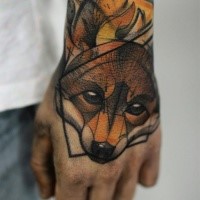 Sketch style colored hand tattoo of small fox head