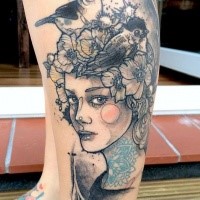 Sketch style colored leg tattoo of woman face with birds and flowers