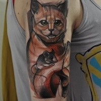 Sketch style colored shoulder tattoo of little cat with mouse