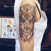 Sketch style colored shoulder tattoo of beautiful lion with crown