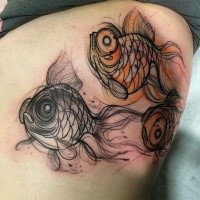 Sketch style colored tattoo of beautiful fishes