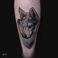 Sketch style colored thigh tattoo of very detailed wolf