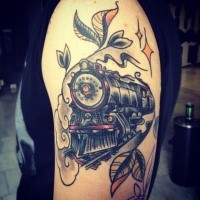 Sketch style colored upper arm tattoo of large train stylized with stars and leafs