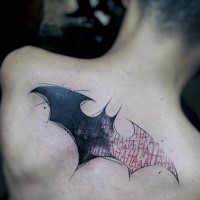 Sketch style colored upper back tattoo of Batman sign and lettering
