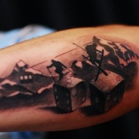 Skiers in mountains and devils bones forearm tatoo