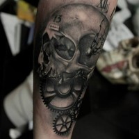 Skull and a clock face tattoo on forearm by Razvan Popescu