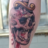 Skull broken with dagger tattoo
