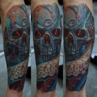 Skull and tentacles of an octopus tattoo on forearm by Dmitriy Samohin